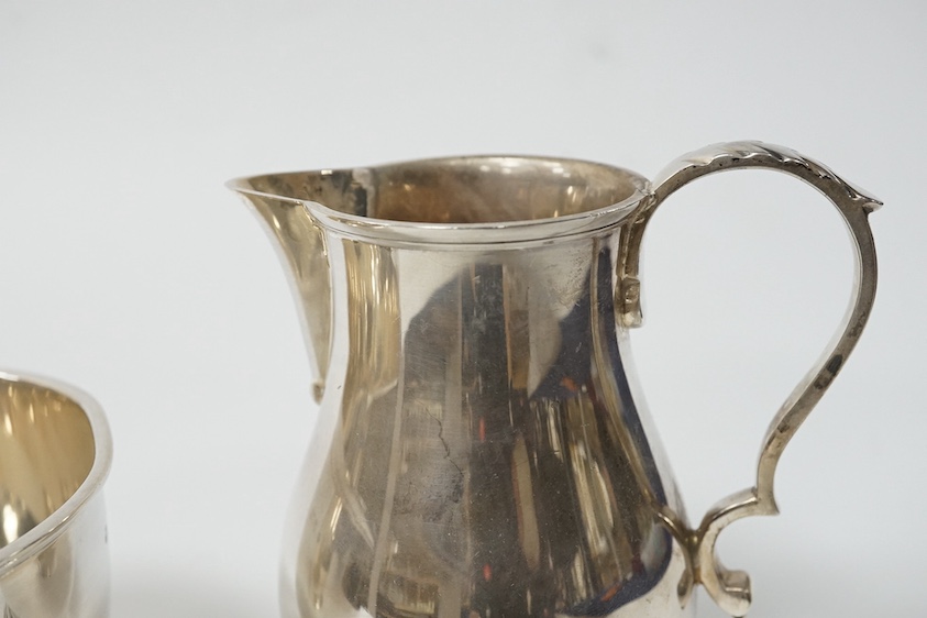 A George VI silver cream jug and sugar bowl by Blackmore & Fletcher Ltd, London, 1939, jug 10.9cm, 11.9oz, with engraved inscription. Condition - fair to good